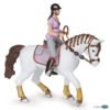 Avec la figurine Cavalière fashion rose et son cheval, découvrez le monde des chevaux.