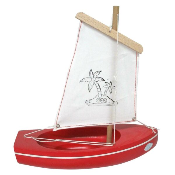 petit bateau en bois à voile blanche avec une coque de couleur rouge