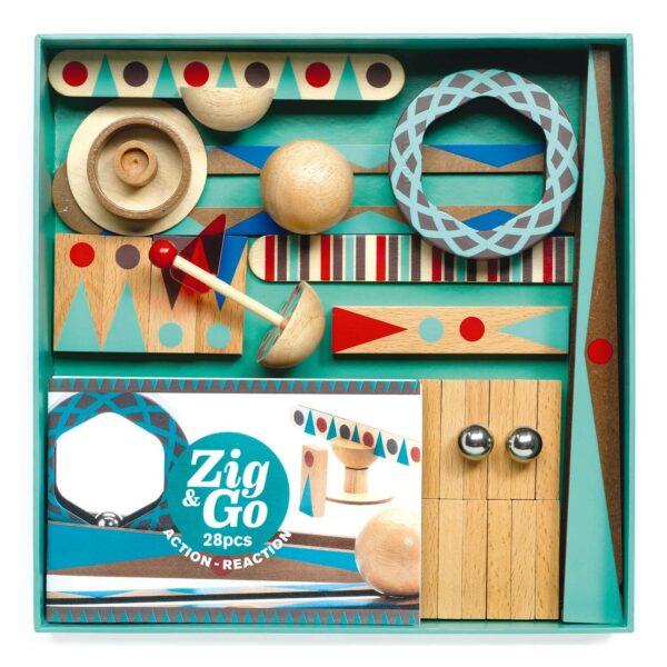 intérieur de la boite du jeu Zig & Go Roll avec les billes en métal la bille en bois les dominos un cercle de bois des rampes...