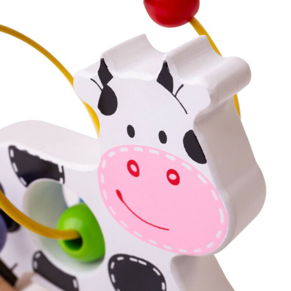 Une jolie vache en bois qui bascule et qui fait office de boulier ! Laissez vous séduire par ce jouet d'éveil aux belles couleurs vives pour les enfants dès 12 mois.