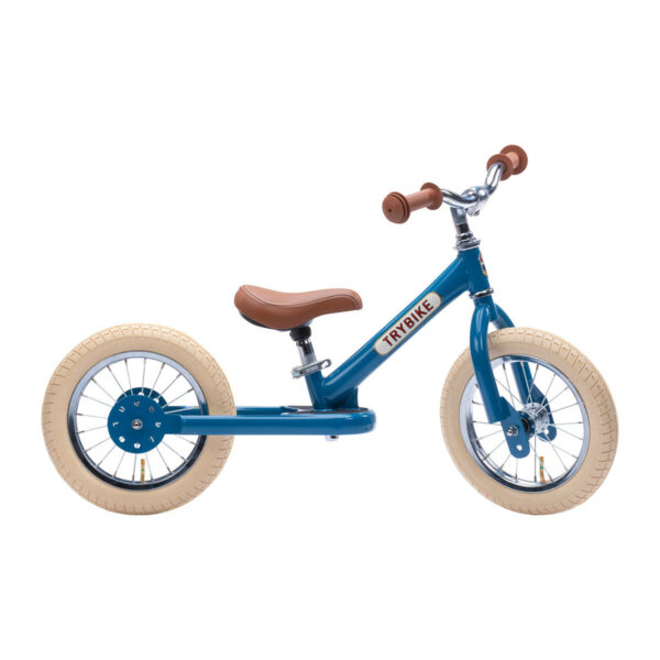 Cette belle draisienne bleue est un vélo sans pédales qui va initier l'enfant au vélo.