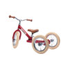 Ce beau tricycle transformable rouge Trybike tout en acier se convertit facilement de tricycle en draisienne ou vélo sans pédales.