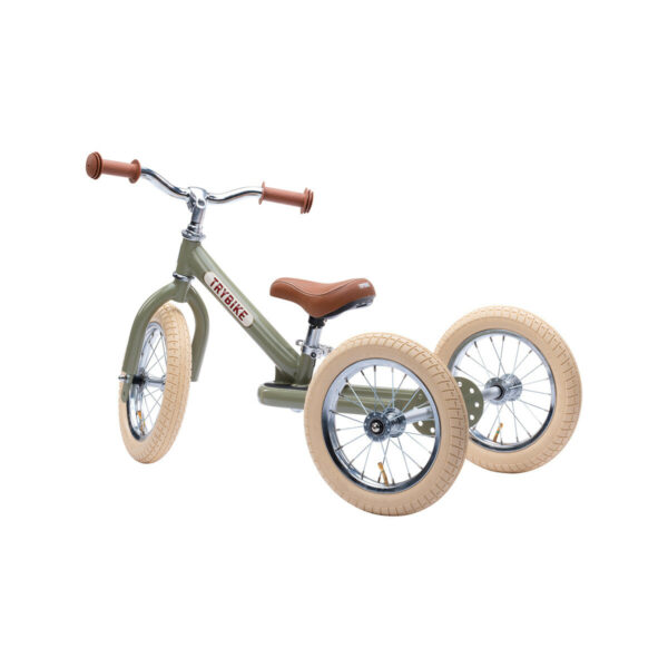 Ce beau tricycle transformable vert Trybike tout en acier se convertit facilement de tricycle en draisienne ou vélo sans pédales.