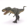 La figurine Dinosaure T-rex courant vert vous permet d'aller à la rencontre du monde fascinant des dinosaures.