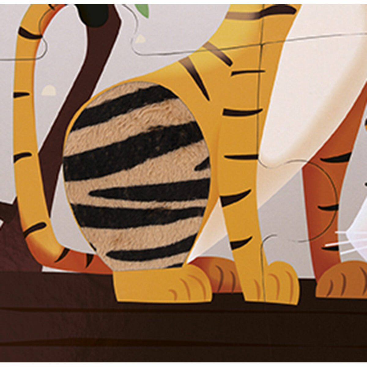 Puzzle-tactile-Une-journée-au-zoo De belles illustrations aux couleurs vives accompagnées de pièces en textures et un poster du puzzle, en voilà un jeu parfait pour votre bout de chou !