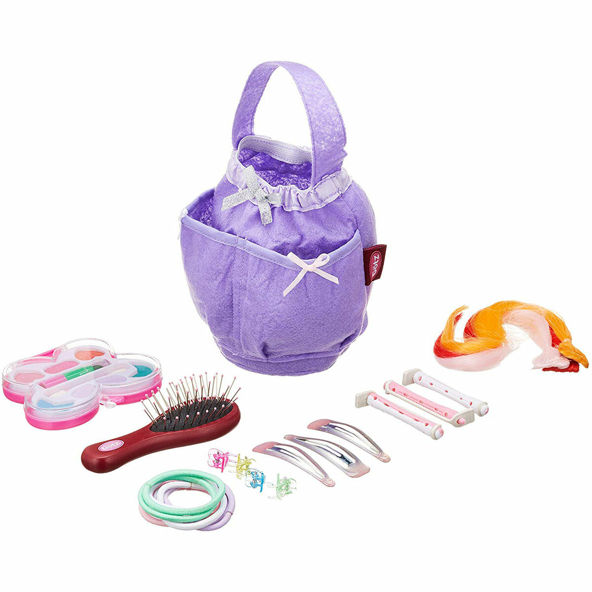 Accessoires-tête-à-coiffer Rien n'a été oublié pour rendre cette poupée très belle : brosse à cheveux, palette de maquillage, 10 bigoudis, 6 barrettes, 24 pinces crocodiles, 8 élastiques, 1 chouchou brillant, des extensions de cheveux... de quoi s'occuper pendant des heures !