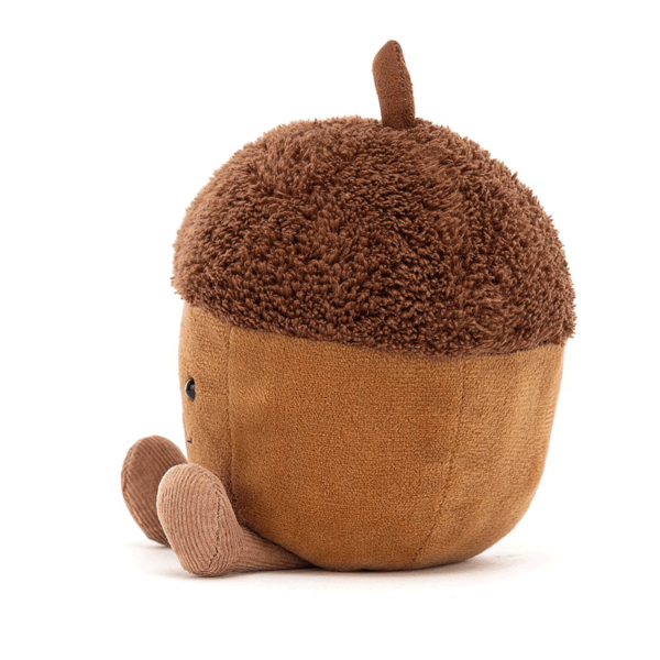 Avec sa peau toute douce de couleur marron clair et son chapeau marron foncé, c' est un adorable jouet