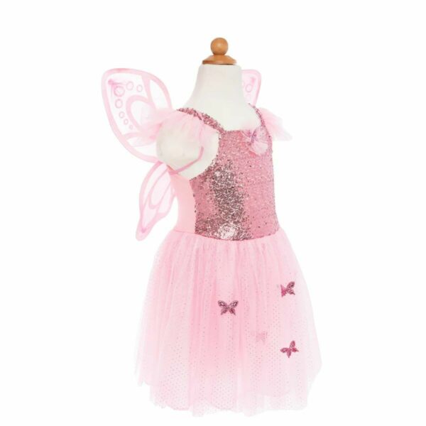 Robe papillon rose. Cette robe a une jupe ample en tulle rose et un incroyable haut à paillettes roses avec des manches en tulle. Elle est associée à des ailes scintillantes roses et imprimées de paillettes, cette combinaison ailes et robe est l'accessoire de fête idéal.
