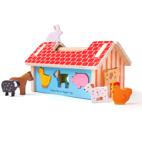 La boîte à formes en bois sur le thème de la ferme est un jouet d'éveil trieur destiné aux enfants dès 12 mois.