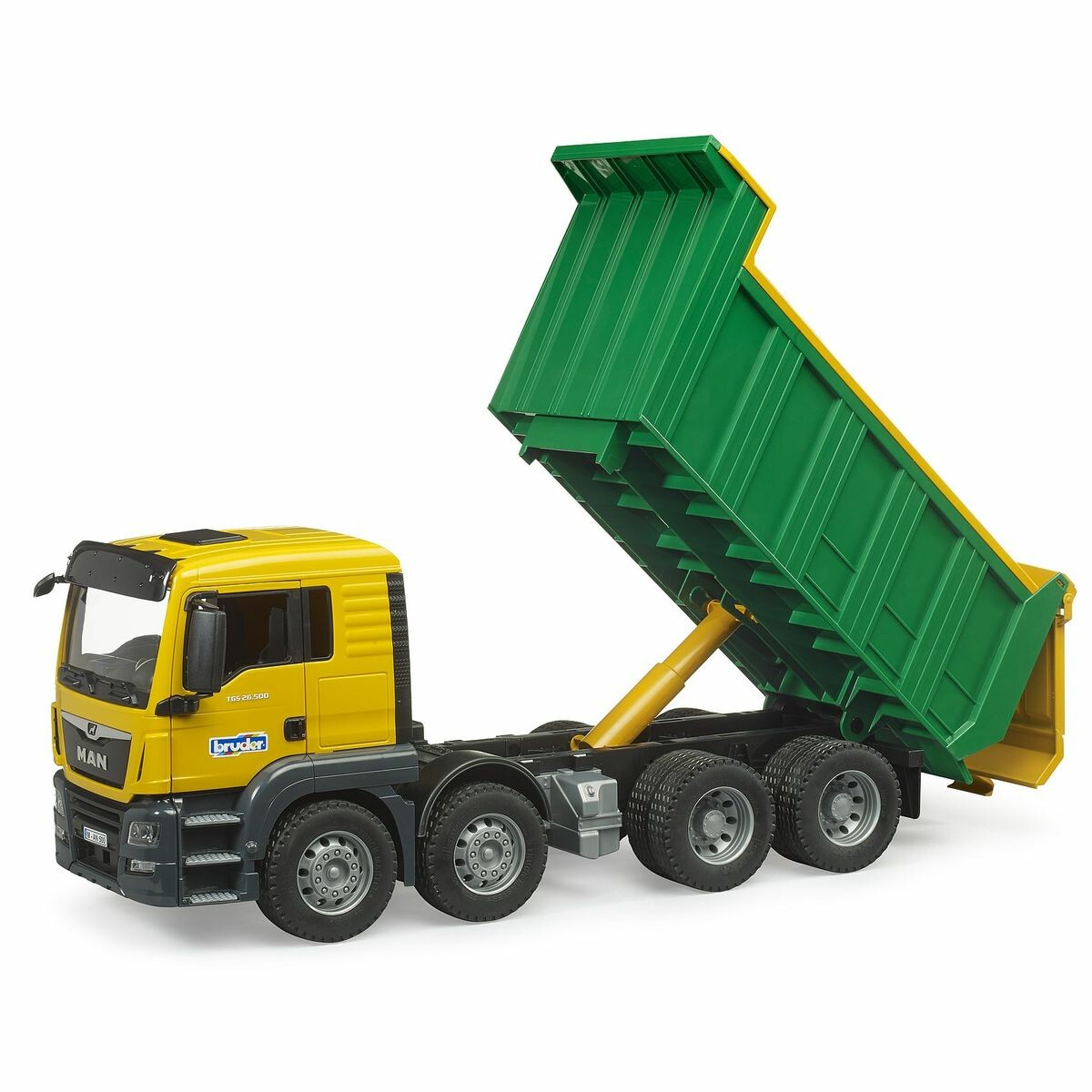 La cabine bicolore est pourvue de portes pouvant être ouvertes et offre un espace de travail moderne. La grande benne basculante du camion est équipée d’un panneau arrière qui s’ouvre automatiquement pour déverser le chargement. Pour les utilisations difficiles, le camion à benne basculante MAN est équipé de 4 essieux et de pneus profilés robustes.