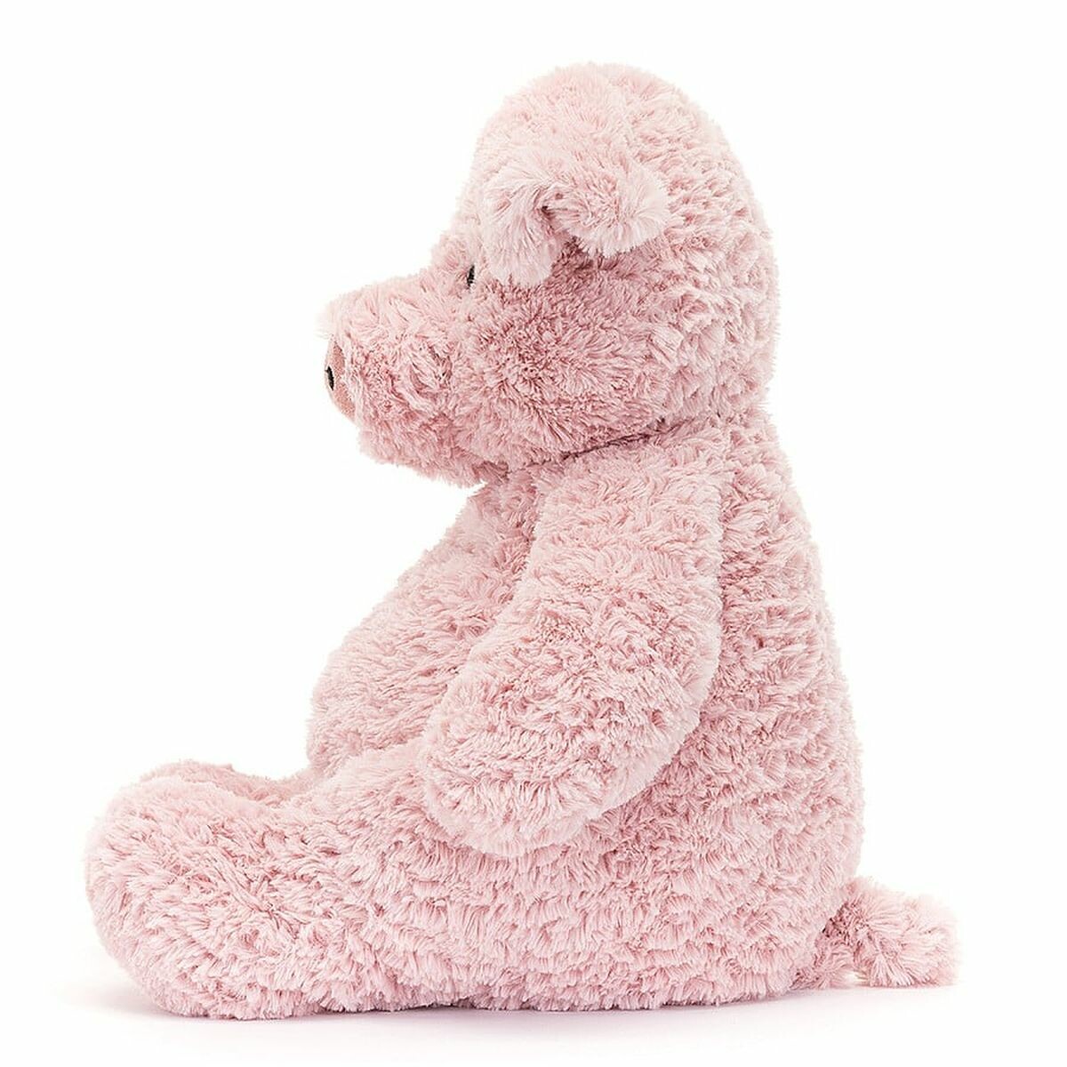 Douce comme la barbe à papa avec un gros ventre rebondi, des oreilles repliées et une queue bouclée, cette peluche est irrésistiblement câline